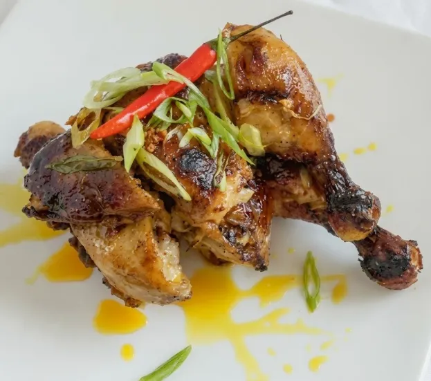 Bagnet Kare-Kare — signature crispy pork belly dish at Jeepney Winnipeg